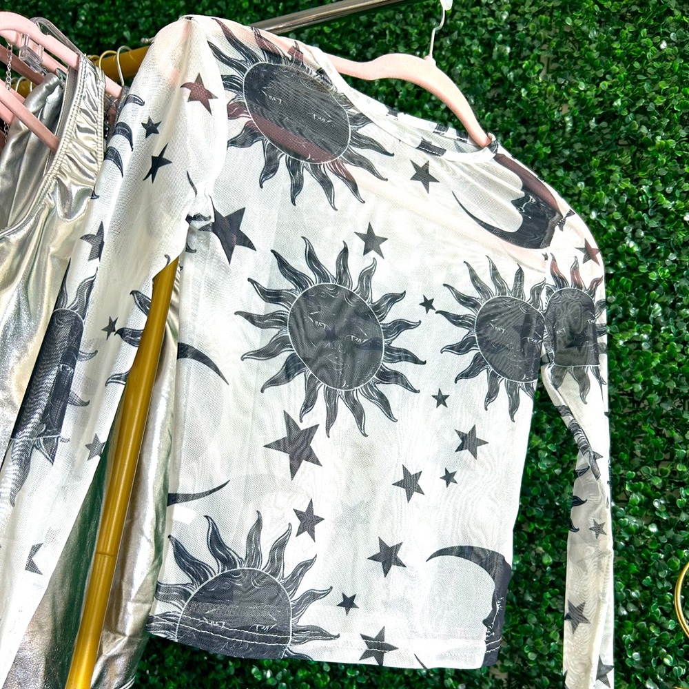 Very cute size small shear long sleeve moon and sun top. Very light